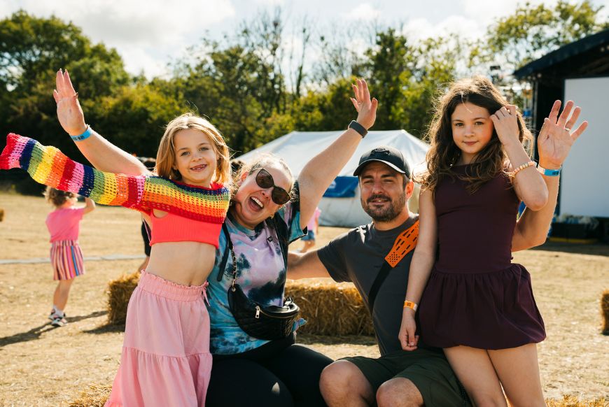 a family of four posing for the camera